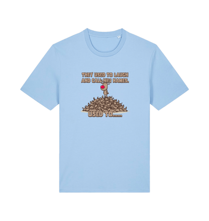 light blue christmas t-shirt with the graphic of rudolph stood on tp of a pile of reindeer and the slogan 'they used to call him names used to...'