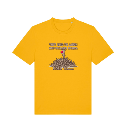 yellow christmas t-shirt with the graphic of rudolph stood on tp of a pile of reindeer and the slogan 'they used to call him names used to...'