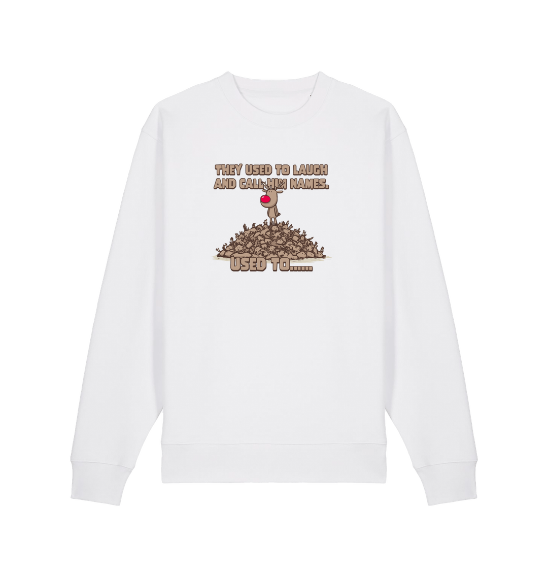 white christmas sweater with the graphic of rudolph stood on top of a pile of reindeer and the slogan 'they used to laugh and call him names used to... '
