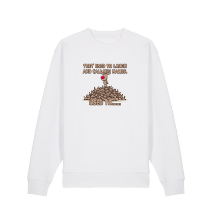 white christmas sweater with the graphic of rudolph stood on top of a pile of reindeer and the slogan 'they used to laugh and call him names used to... '
