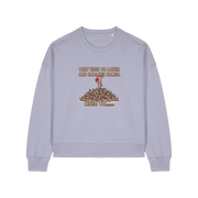 lavender christmas sweater with the graphic of rudoph stood ontop of a pile of reindeer and the slogan 'they used to laugh and call him names used to ..'