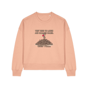 peach christmas sweater with the graphic of rudoph stood ontop of a pile of reindeer and the slogan 'they used to laugh and call him names used to ..'