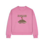 pink christmas sweater with the graphic of rudoph stood ontop of a pile of reindeer and the slogan 'they used to laugh and call him names used to ..'