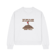 white christmas sweater with the graphic of rudoph stood ontop of a pile of reindeer and the slogan 'they used to laugh and call him names used to ..'