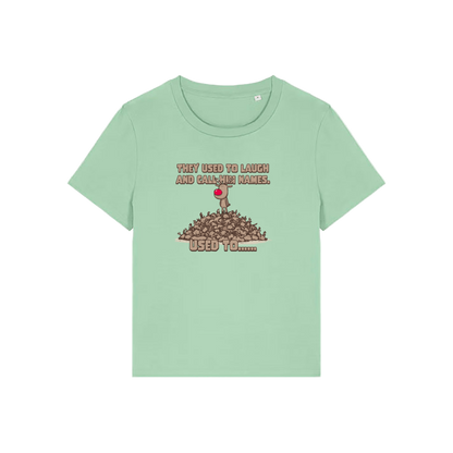 green christmas graphic t-shirt with a rudolph stood on top of a pile of reindeer and the slogan 'they used to alaugh and call him names .. used to'