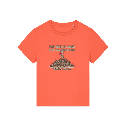 orange christmas graphic t-shirt with a rudolph stood on top of a pile of reindeer and the slogan 'they used to alaugh and call him names .. used to'