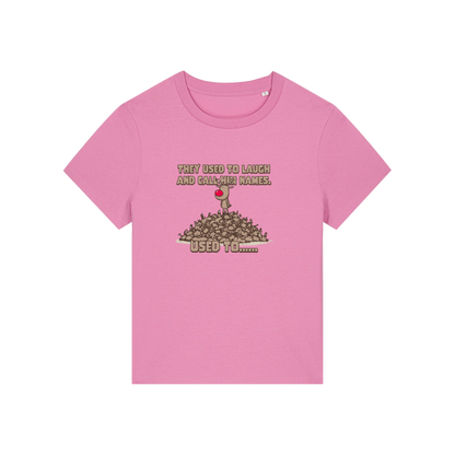 pink christmas graphic t-shirt with a rudolph stood on top of a pile of reindeer and the slogan 'they used to alaugh and call him names .. used to'