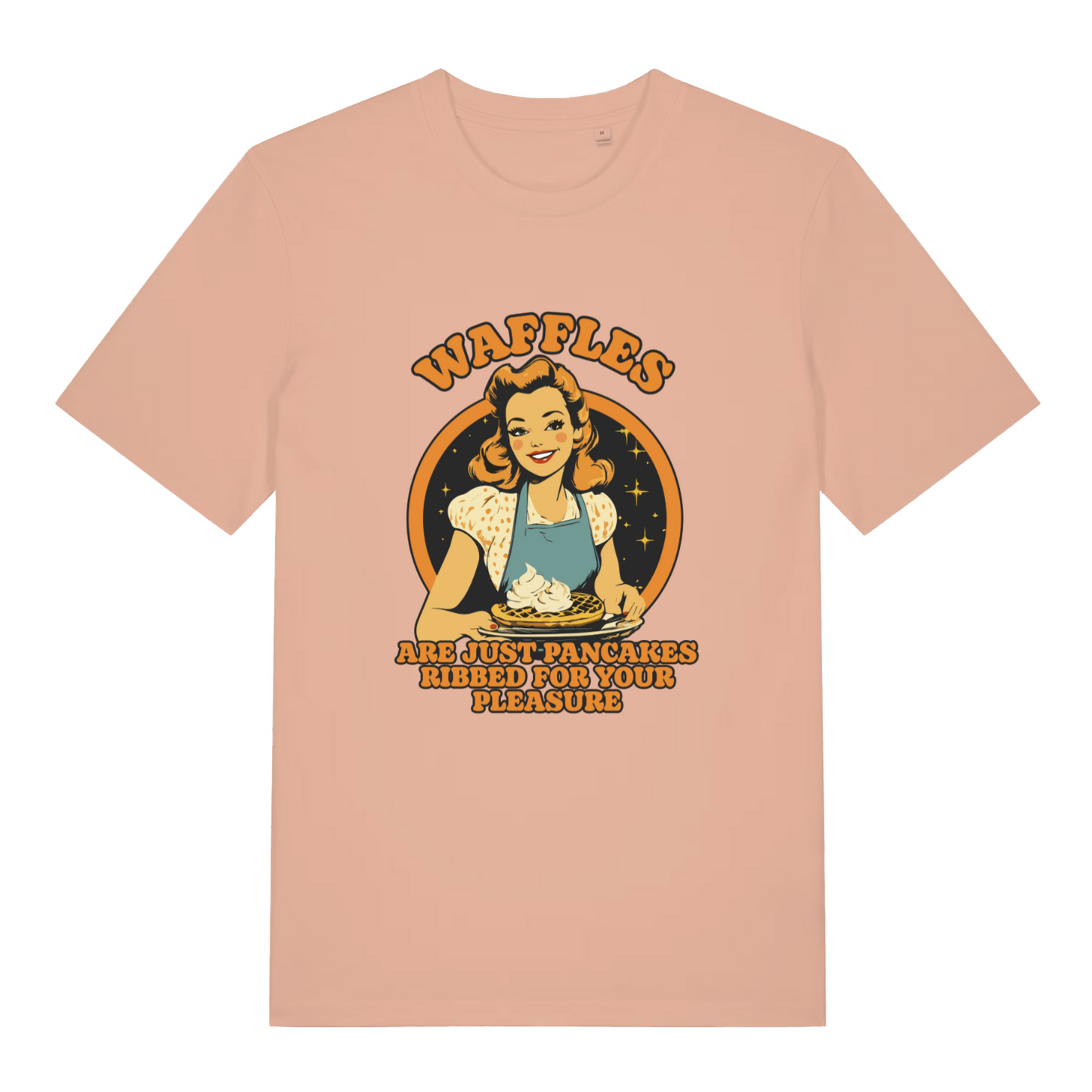peach women's funny offensive t-shirt with a graphic of a woman making waffles and the slogan 'waffles are just pancakes ribbed for your pleasure'
