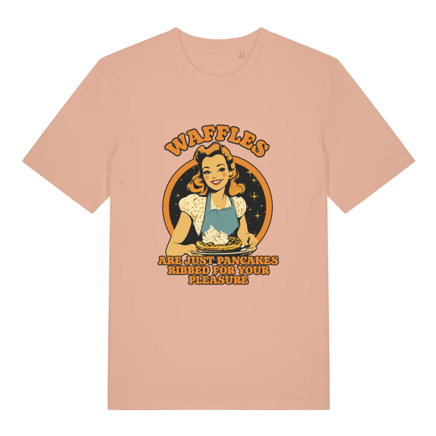 peach women's funny offensive t-shirt with a graphic of a woman making waffles and the slogan 'waffles are just pancakes ribbed for your pleasure'
