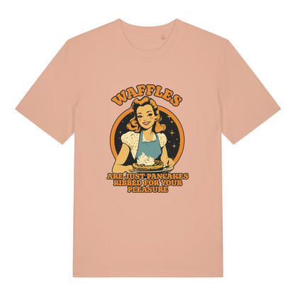 peach women's funny offensive t-shirt with a graphic of a woman making waffles and the slogan 'waffles are just pancakes ribbed for your pleasure'