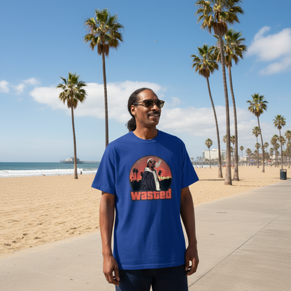 Person wearing a blue t-shirt with a graphic design on a beach with palm trees.