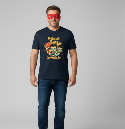 Man wearing a navy t-shirt with superhero graphic and red mask on gray background