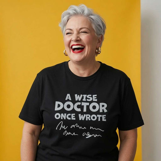 Woman laughing while wearing a black A Wise Doctor Once Wrote t-shirt, witty ladies medical text design full of pure attitude