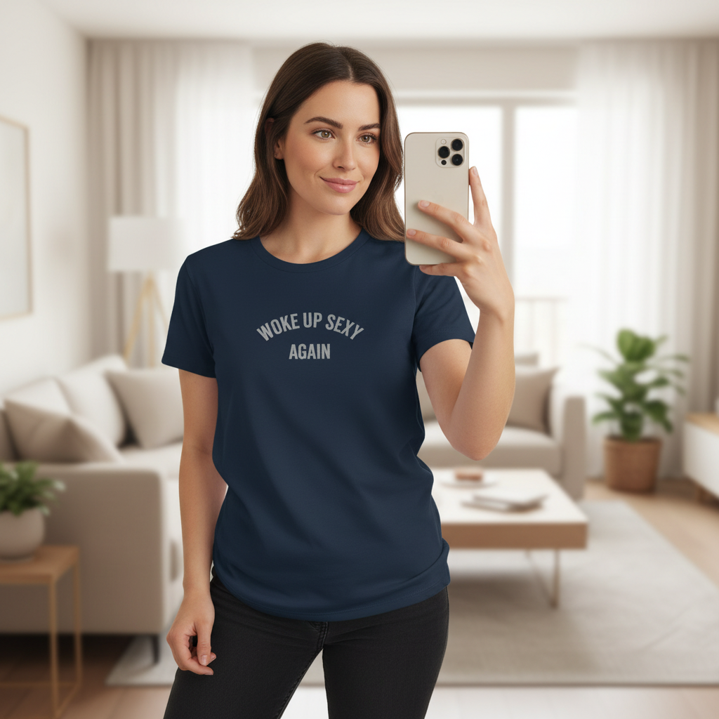 Woman wearing a navy blue t-shirt with 'Woke Up Sexy Again' text in a living room.