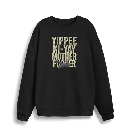 black christmas jumper with the graphic of a man falling and the slogan 'yippee ki-yay mother fucker'