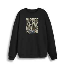black christmas jumper with the graphic of a man falling and the slogan 'yippee ki-yay mother fucker'