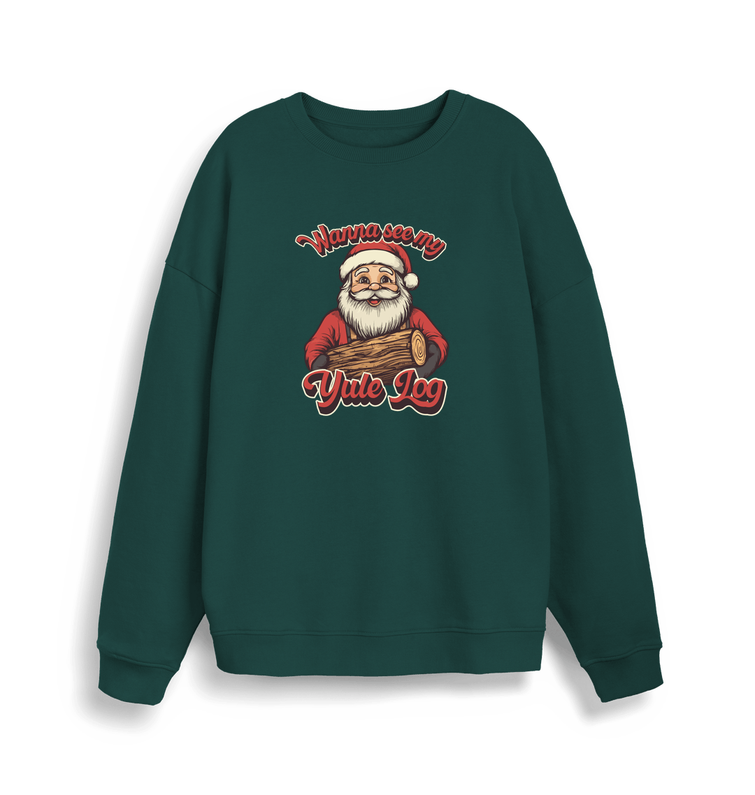 green christmas sweater with the graphic of santa holding a log and the slogan 'wanna see my yule log'