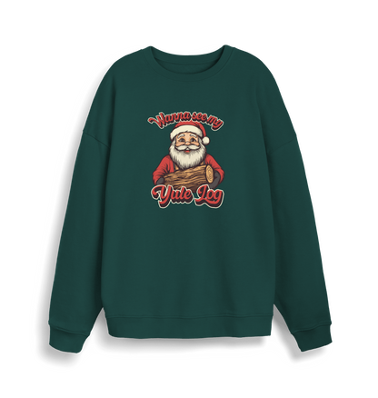 green christmas sweater with the graphic of santa holding a log and the slogan 'wanna see my yule log'